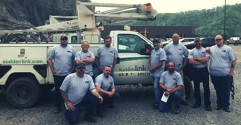 Ten Altice - Suddenlink employees in front of truck in WV.
