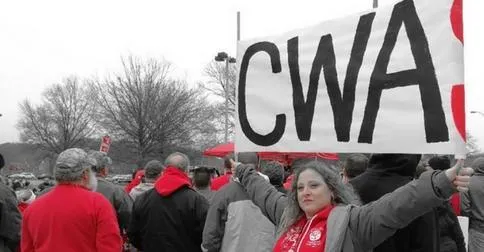 CWA Frontier members rally and hold CWA sign.