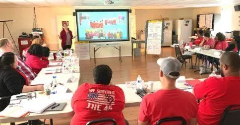 CWA members watch Boot Camp training slides.