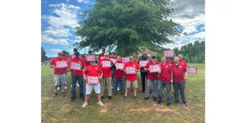 Brightspeed VA members wear red and hold signs