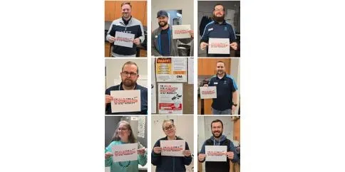 CWA Local 2009 AT&T Mobility members holding "All In" signs