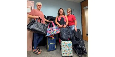 three Local 13500 officers with luggage